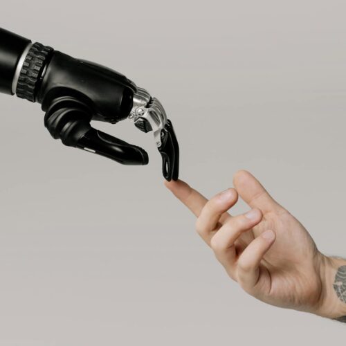 bionic hand and human hand finger pointing