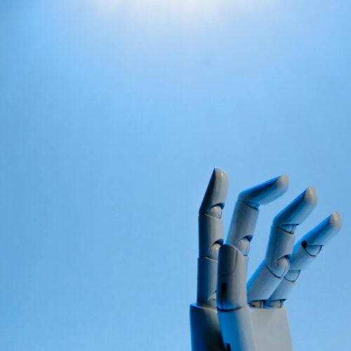 robot fingers on blue background